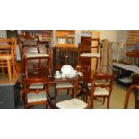 An extending dining table and 8 chairs.