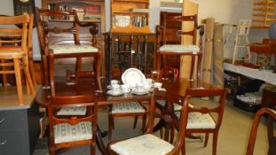 An extending dining table and 8 chairs.
