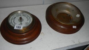 A barometer and a barometer case.