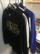 A quantity of XXL t-shirts and clothes including Star Wars & also a Foo Fighters tour jacket.