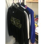 A quantity of XXL t-shirts and clothes including Star Wars & also a Foo Fighters tour jacket.