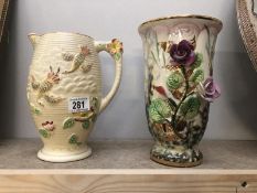A Price Bros. jug and a floral decorated vase.