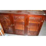 A mahogany glazed cabinet.