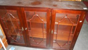 A mahogany glazed cabinet.