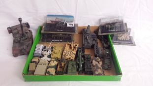 A quantity of boxed and unboxed military vehicles.