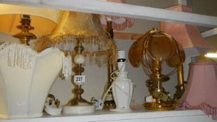 A shelf of table lamps.