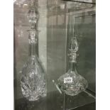 2 cut glass decanters.