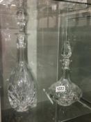 2 cut glass decanters.