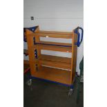 A trolley with shelves.