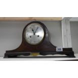 A mahogany inlaid mantel clock.