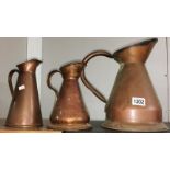 3 copper jugs.