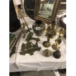 A mixed lot of brass ware including candlesticks.