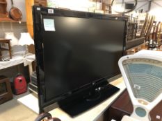 An LG 47" TV with remote.