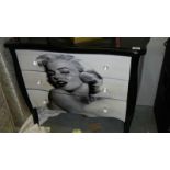 A chest of drawers depicting Marilyn Monroe.