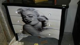 A chest of drawers depicting Marilyn Monroe.