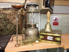 A hurricane lamp, bell, boxes etc.