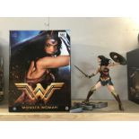 A boxed Wonder Woman statue.
