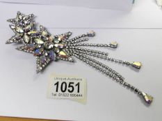 A Butler and Wilson 'Shooting Star' brooch.