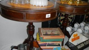 A pair of tripod drum tables.