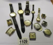 A quantity of old wrist watches and watch heads including spares.