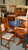 An oak dining table and 6 chairs.