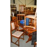 An oak dining table and 6 chairs.