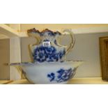 A blue and white jug and basin set.