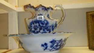 A blue and white jug and basin set.