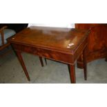 A mahogany fold over tea table.