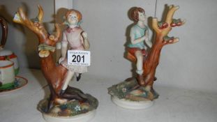 A pair of boy and girl figures.