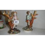 A pair of boy and girl figures.