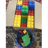 A box of giant Lego style bricks & large Lego style bricks.