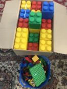 A box of giant Lego style bricks & large Lego style bricks.