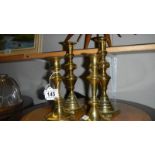 2 pairs of Victorian brass candlesticks.