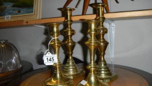 2 pairs of Victorian brass candlesticks.