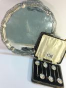 A set of 6 silver berry spoons and a three footed silver plated tray.