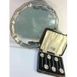 A set of 6 silver berry spoons and a three footed silver plated tray.