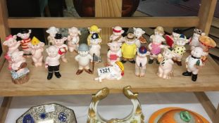 A collection of 25 piggies figurines.