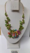 A multi coloured stone set floral necklace.