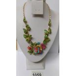 A multi coloured stone set floral necklace.