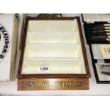 A Vintage Henri Winterman's shop cigar display cabinet.