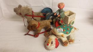 A MOBO tinplate puppy dog and other pull along toys.