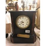 A black slate mantel clock.