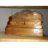 A wooden letter rack.