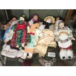 A quantity of costume dolls.