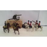 A boxed Britain's no 1201 Royal Artillery gun tinplate tank and 8 mounted soldiers plus gun.