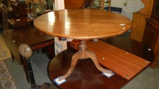 An oak tripod table.