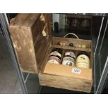 3 bottles of wine in a wooden case.