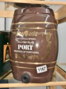 A brown pottery port barrel.