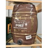 A brown pottery port barrel.